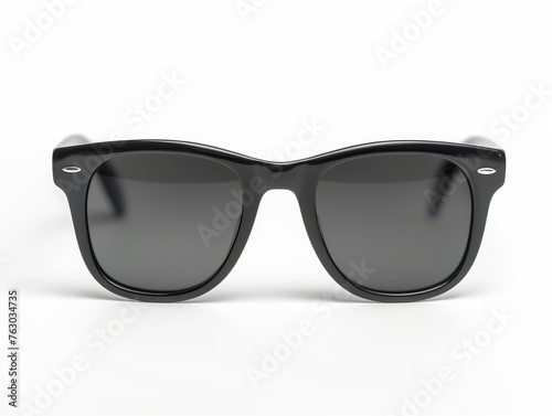 A sleek pair of classic black sunglasses with gradient lenses isolated on a white background.