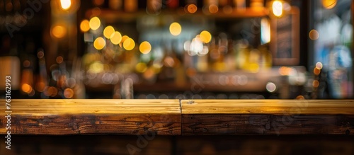 A wooden table blending with the blurred background of a city bar at night, illuminated by automotive lighting. The scene combines elements of wood, metal, asphalt, and entertainment