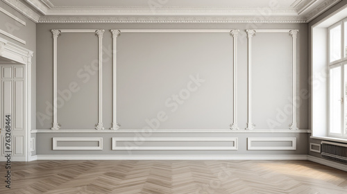 A large, empty room with white walls and a wooden floor. The room is very spacious and has a clean, minimalist look