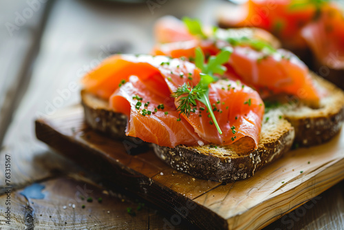 Close-up of smoked salmon on open-faced sandwiches, ideal for culinary themes.