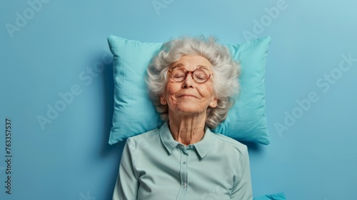 Elderly man sleeping on pillow isolated on pastel pink colored background Sleep deeply peacefully rest. Top above high angle view photo portrait of satisfied .senior wear pink shirt