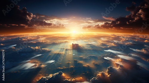 view of the sunrise above the clouds