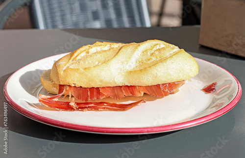 A sandwich of Spanish Iberian ham. Spanish tapas. 