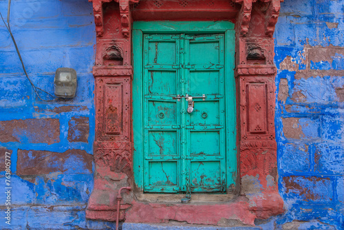 Wood carved colorful door in the blue city of Jodhpur, Rajasthan, India
