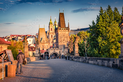 Impressive summer view of Charles bridge on Vltava river (Karluv Most) with statues and Prague castle. Marvelous morning cityscape of Prague, Czech Republic. Traveling concept background.