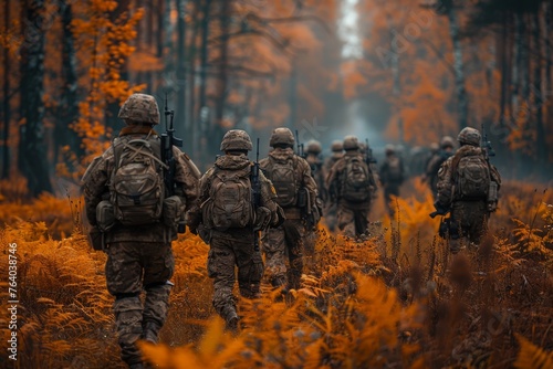A squadron of soldiers marching in uniform through an autumnal forest, illustrating teamwork and tactical deployment