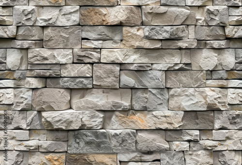 Modern stone veneer wall, seamless light-colored texture 