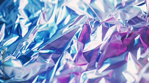 Close-up shot capturing the vibrant reflective surface of an abstract foil with edgy textures and a blend of pink and blue shades