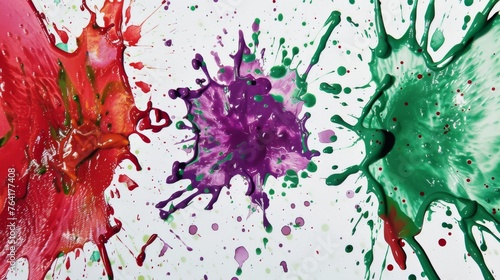 Three vividly colored paints have been splattered across a pristine white surface, creating a dynamic and vibrant artistic display. Each paint splatter stands out uniquely, adding interest and contras