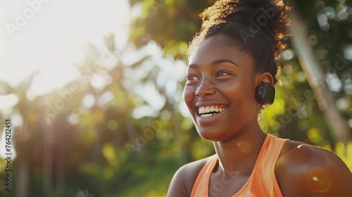 technology, sport and people concept - happy smiling young african american woman with fitness