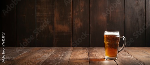 A glass of beer on a wooden table