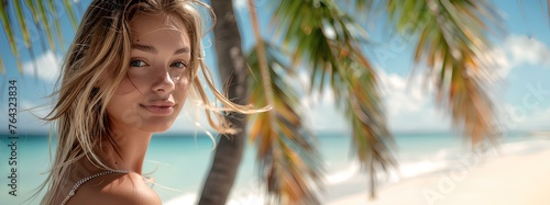 portrait of a very beautiful young blonde woman in front of an exotic paradise beach