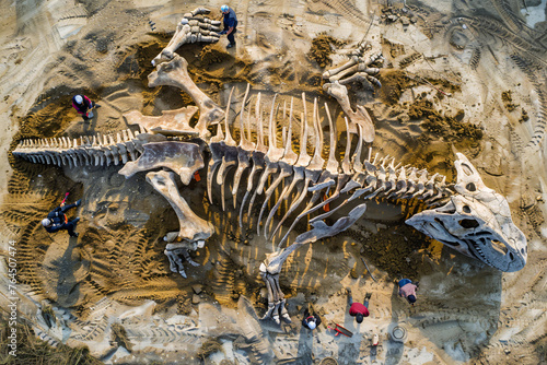 paleontologists and archaeologists and a huge dinosaur skeleton