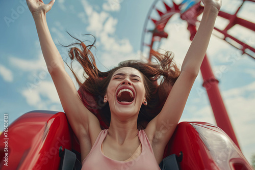 Woman raising hands high on red roller coaster