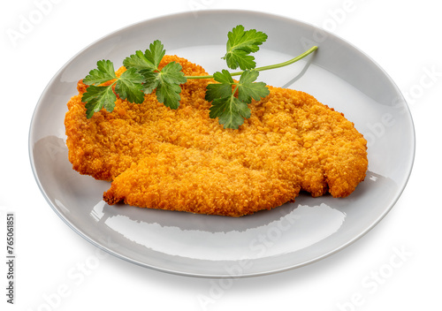 Breaded meat steak fried in dish with parsley leaves, isolated