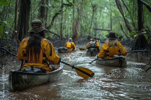 Group of people paddling canoes through water
