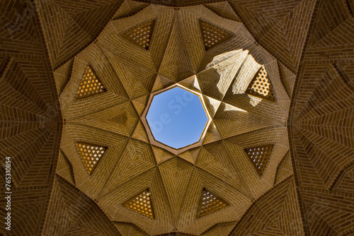 Detail of the dome of the Abbasi caravanserai in Meybod, Yazd, Iran with eye catching details of brick work.