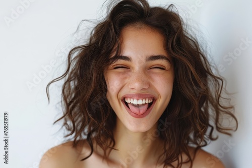 Young happy brunette woman is winking and showing tongue on a white background, Generative AI