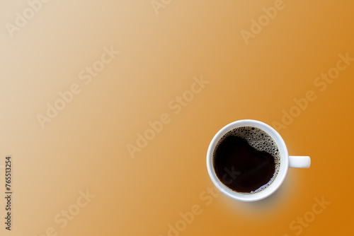 Black coffee cup on orange background.