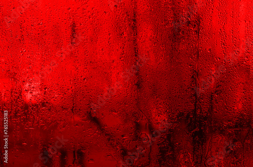 wet glass. abstract red background