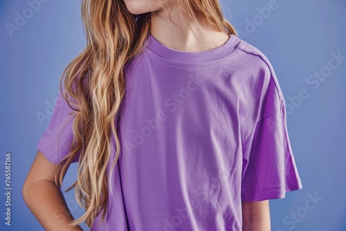 Half portrait of a child in a lilac t-shirt, hidden face suggesting anonymity and universality, Concept of childhood simplicity and apparel display
