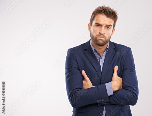 Entrepreneur, man and studio with arms crossed on white background with deadline and business concern. Portrait, entrepreneur and confident with company growth in suit and professional with mockup