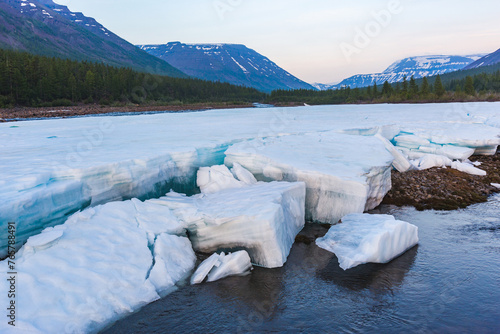 Ice on the banks of the river Hoisey. Polar day on Putorana Plateau, Taimyr, Russia
