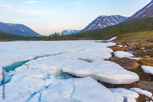 Ice on the banks of the river Hoisey. Polar day on Putorana Plateau, Taimyr, Russia