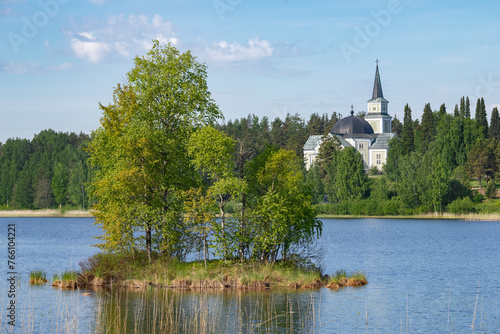 Warm summer landscape with an old Lutheran church. Ruokolahti, Finland