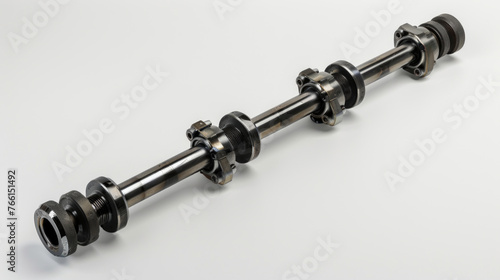 A reinforced steel drive shaft, with balanced universal joints and durable construction, transmitting power from the transmission to the differential with precision