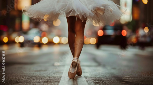 Ballerina dancing on the street, closeup on her legs and ballet shoes