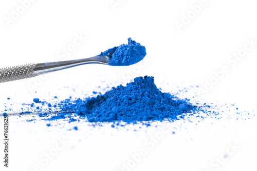 ultramarine pigment, dry paint on a white background, macro