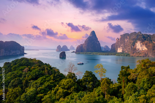 Sunset beautiful landscape of nature Thailand, Long tail boat with tourist on Hong tropical island and Phang Nga bay in turquoise sea, aerial view