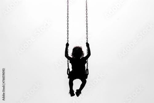 A young girl happily swinging on a swing, perfect for playground or childhood themes