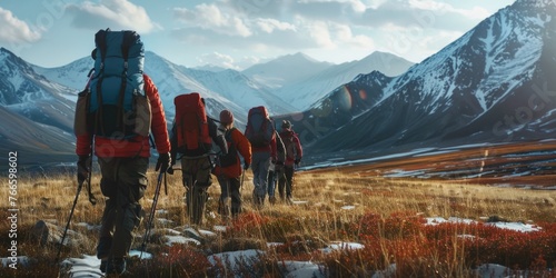 A group of people with backpacks walking through a field. Suitable for outdoor and adventure themes