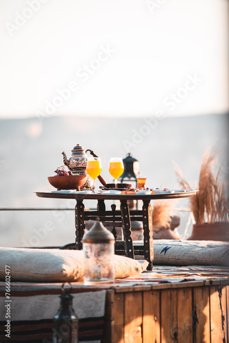 Luxury Exotic Delicious Breakfast Al Fresco - Outdoors on a terrace at sunrise overlooking Goreme, Cappadocia (Kapadokya) National Park, Turkey with Turkish Tea and Fruit Juice