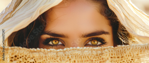 Biblical character. Close up portrait of a black woman with a shawl looking up.