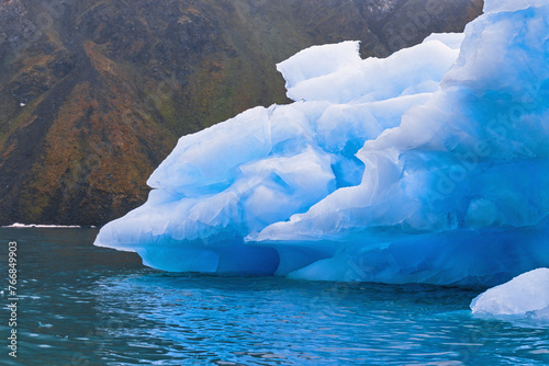 Iceberg floating in a fjord at Svalbard island
