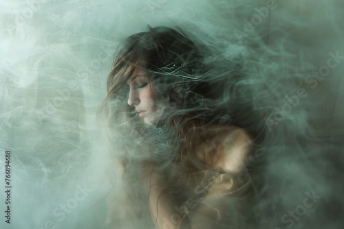 Young beautiful woman with tangled unkempt hair on blur abstract background. Concept of social or psychological problem. Blur art photography. 