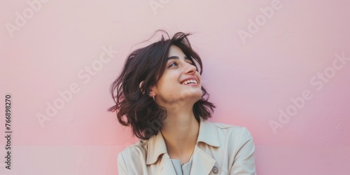 Smiling South American Woman Against Pink Wall