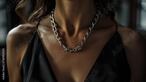Elegant Silver Necklace on a Person in Black Dress