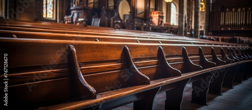 Rows of wooden benches line the hardwood floor of the empty church building, awaiting worshippers for the next religious event