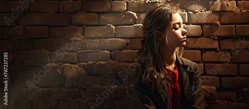 Woman standing in front of brick walls