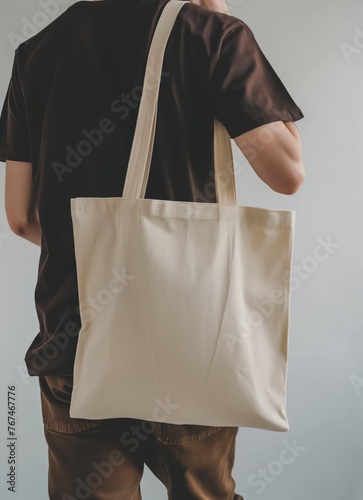 Contemporary Urban Style Mockup with Person Wearing Dark T-Shirt and Carrying Light-Colored Tote Bag Over Shoulder