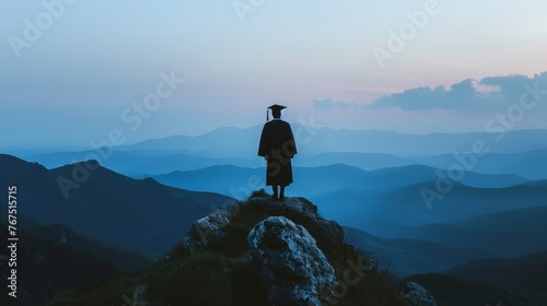 A photo of a silhouette of a graduate standing on a mountaintop overlooking a vast landscape, signifying a new beginning --ar 16:9 Job ID: 36690e7e-71a0-4cbc-a138-6ee4a0412e08