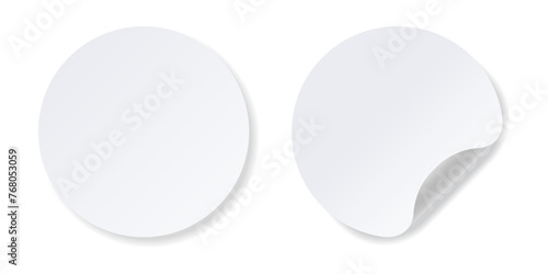 Realistic white round stickers with folded corner.