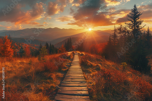 Panoramic autumn landscape with wooden path at sunset. Fall nature background