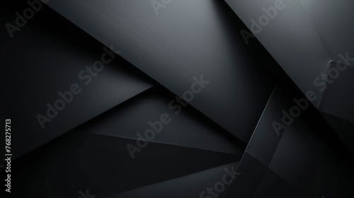 Dark angular shapes creating a mysterious abstract concept. Varying shades of darkness for a sophisticated design.