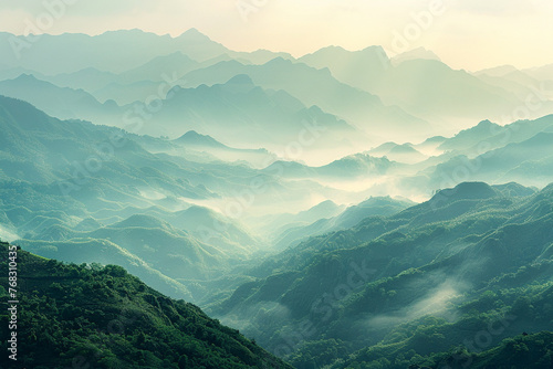 a panoramic view of a mountain range covered in mist at sunrise, evoking the vastness and beauty of nature 