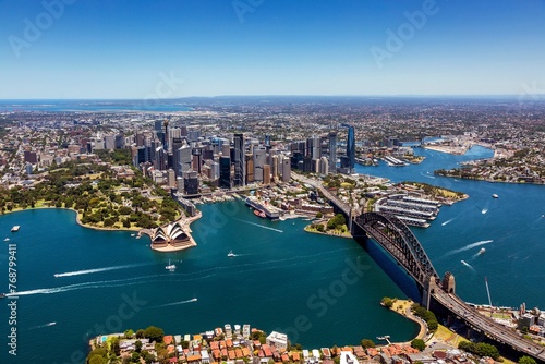 an aerial view of sydney with the harbor and city centre in the distance